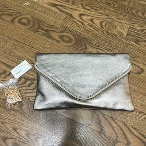 NWT pale gold fold over clutch with removable cross body strap